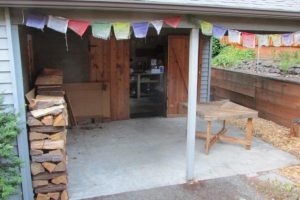 Covered Back Sitting Area and Storage/Work Shop