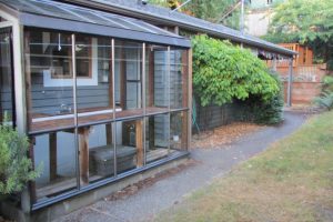 Greenhouse attached to side of house